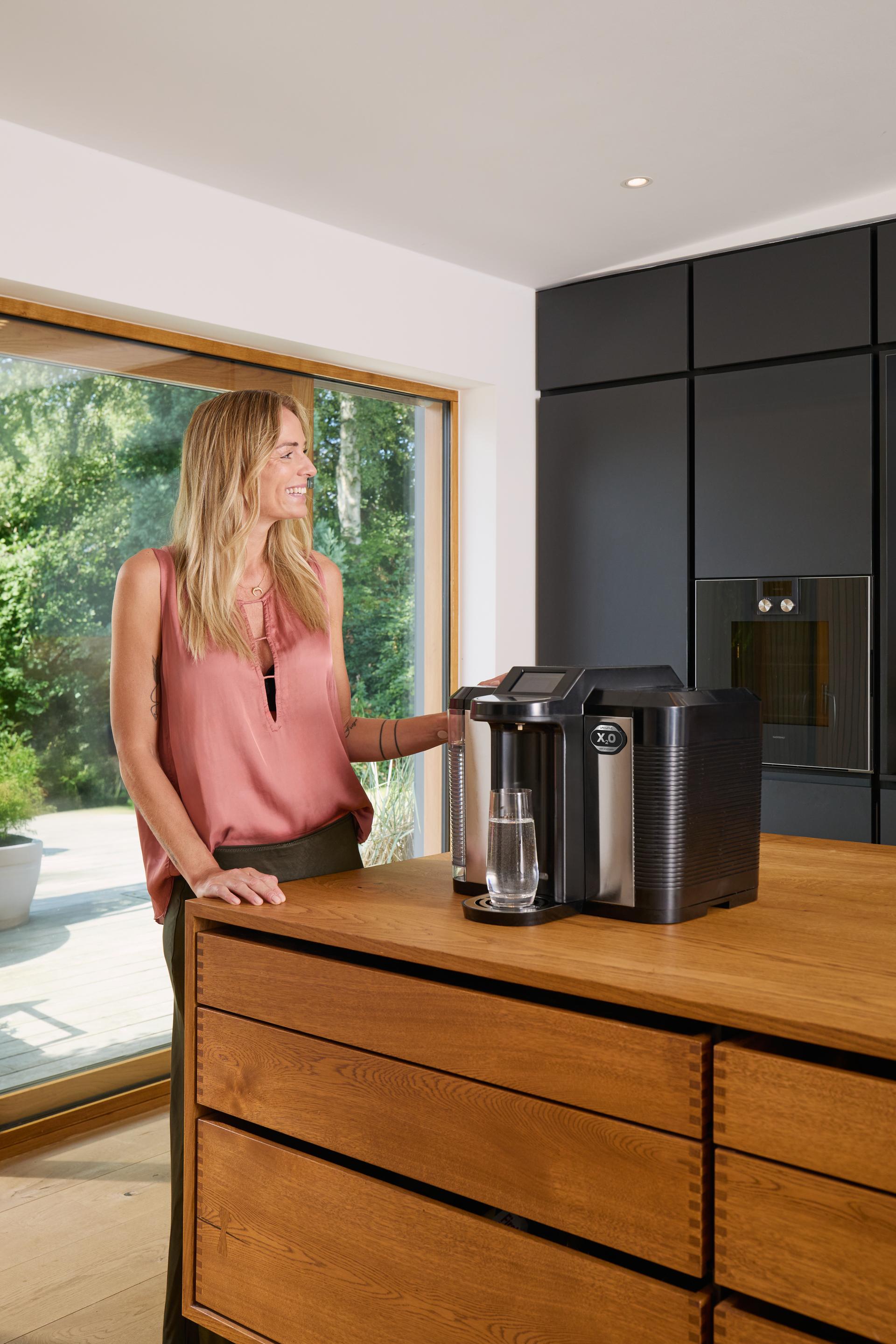 Woman using the LifeWave X2O Water Machine